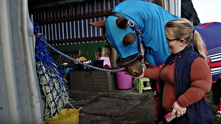 Megan Gregory competing in equestrian events
