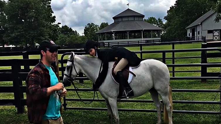 Emotional farewell between equestrian and horse