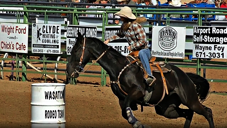 Amberly riding her horse with strength and grace