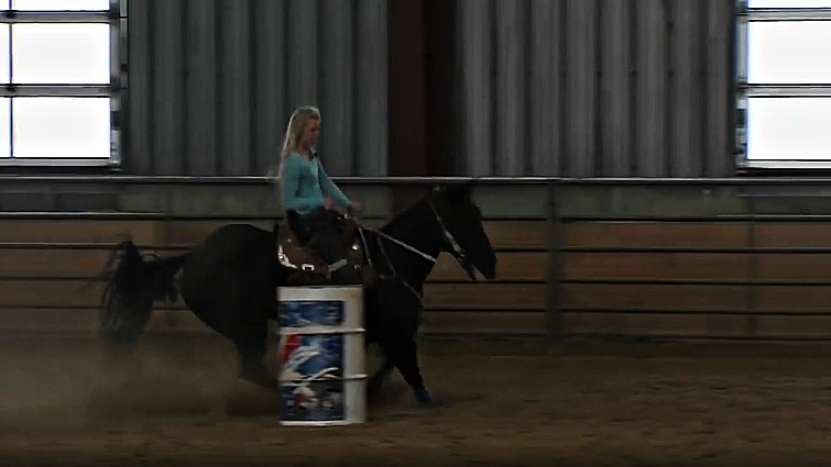 Amberly celebrating her barrel racing success