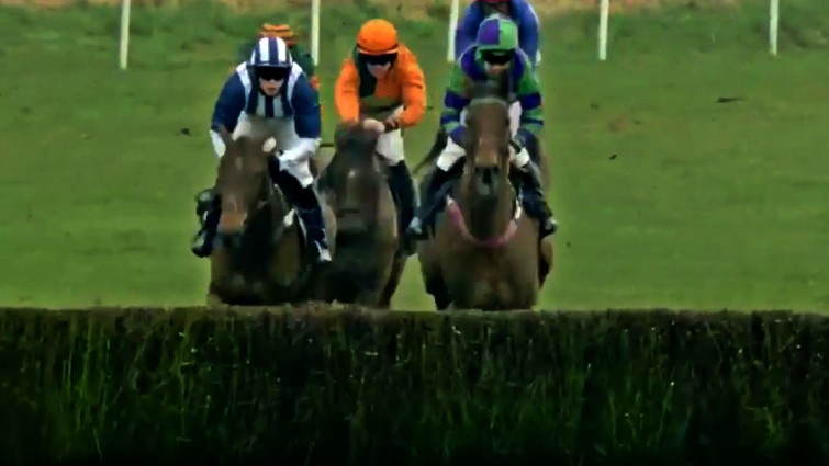 Jockey recovering on horse during race