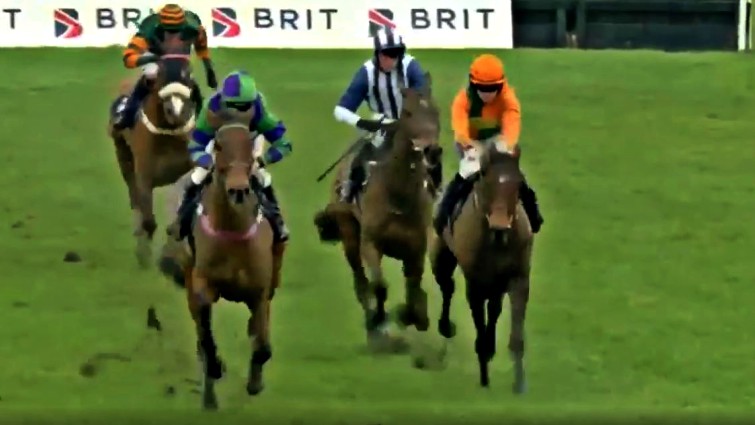 Jockey crossing finish line after recovery
