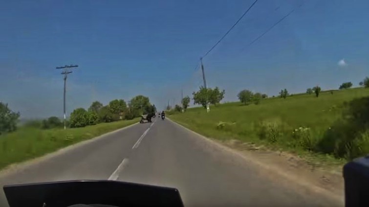 Motorcyclist demonstrating quick reflexes on highway
