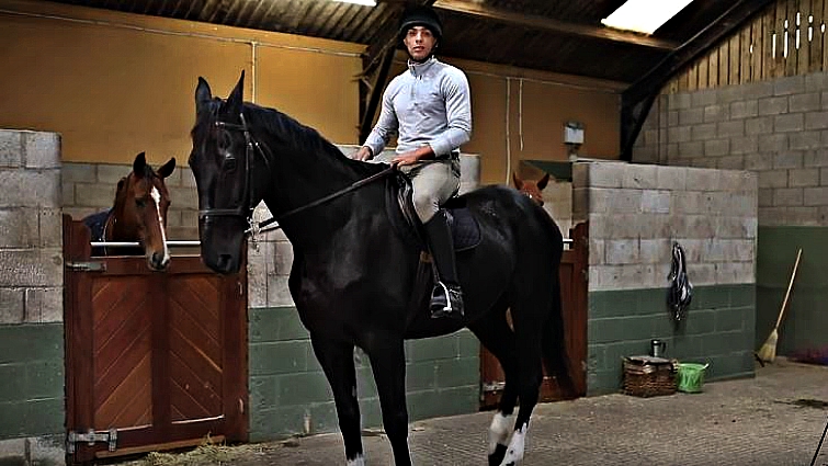 Soldier spending time with retired horse