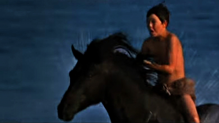 Young actor riding the Black Stallion