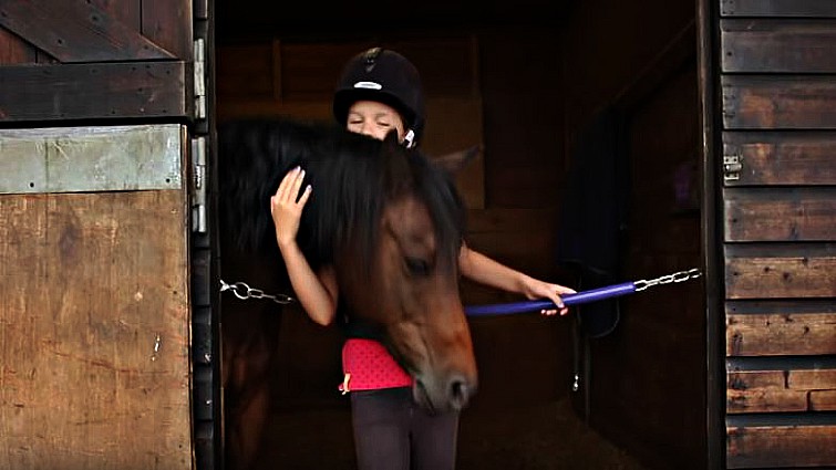 Victoria bonding with her equine companion